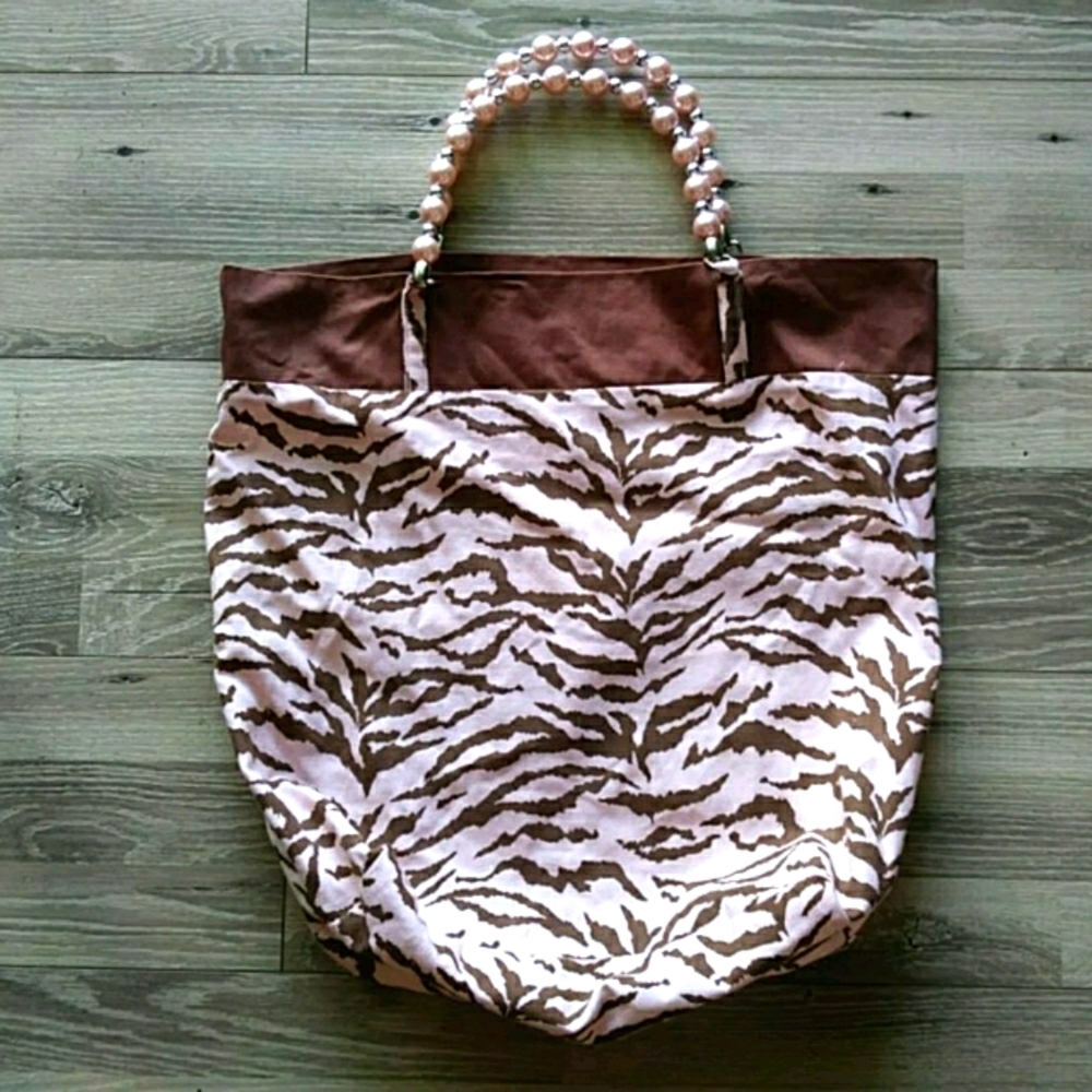 Pink brown animal print with pearl handles…